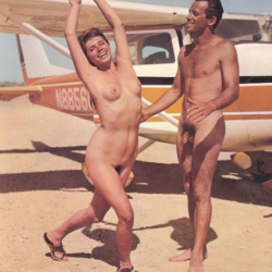 Couple in front of a small plane